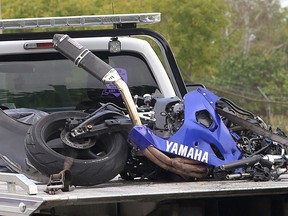 A heavily damaged motorcycle that was involved in a collision with a van is transported from the scene on the back of a flat bed truck on Tuesday at the corner of highways 15 and 2. (Ian MacAlpine /The Whig-Standard)