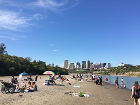 Edmonton residents flock to the new downtown beach Sunday, Aug. 27, 2017, created after the LRT bridge construction changed the current in the North Saskatchewan River.