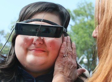 Tears of joy run down Cheyenne Field cheeks, for the legally blind 17-year-old from Toronto can now see thanks to eSight on Tuesday August 29, 2017.The  new electronic glasses enable the legally blind to actually see. Fields wore them for the first time at Casa Loma in Toronto. Veronica Henri/Toronto Sun/Postmedia Network