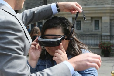 Cheyenne Fields, a legally blind 17-year-old from Toronto can now see thanks to eSight on Tuesday August 29, 2017.The  new electronic glasses enable the legally blind to actually see. Fields wore them for the first time at Casa Loma in Toronto. Veronica Henri/Toronto Sun/Postmedia Network