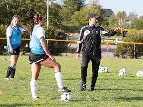 Cambrian College Golden Shield soccer head coach Giuseppe Politi explains a drill to players during training camp in Sudbury, Ont. on Thursday August 24, 2017. Gino Donato/Sudbury Star/Postmedia Network