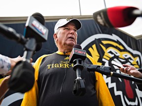 Hamilton Tiger-Cats head coach June Jones speaks to the media about the joint team and CFL decision to backtrack on the hiring of Art Briles as assistant coach following a practice in Hamilton, Ont., on Aug. 29, 2017. (THE CANADIAN PRESS/Aaron Lynett)