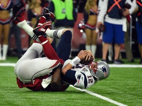 This file photo taken on February 5, 2017 shows Tom Brady of the New England Patriots as he is sacked by Grady Jarrett of the Atlanta Falcons in the fourth quarter during Super Bowl 51 at NRG Stadium in Houston, Texas. (AFP PHOTO)
