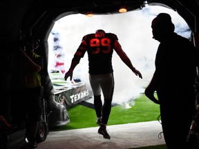 Houston Texans defensive end J.J. Watt runs out of the tunnel as he is introduced before an NFL football preseason game against the New England Patriots on Aug. 19, 2017. (AP Photo/Eric Christian Smith)