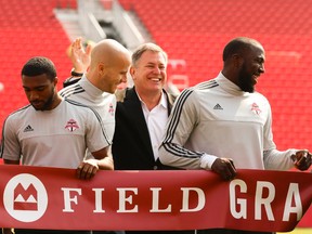 TFC player Michael Bradley and former MLSE CEO Tim Leiweke share a laugh as TFC held its official grand opening of BMO Field in preparation for their 2015 home opener vs, the Houston Dynamo in Toronto, Ont. on Friday May 8, 2015. Jack Boland/Toronto Sun/Postmedia Network