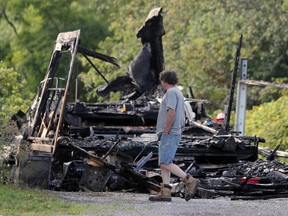 The remains of a fire that destroyed a fifth-wheel trailer on Middle Road in Kingston, Ont. on Wednesday August 30, 2017. Steph Crosier/Kingston Whig-Standard/Postmedia Network