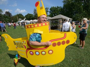 John Erb promotes the upcoming Beatles festival during Gathering on the Green II, on Sunday August 20, 2017 on the Green in Wortley Village. (MORRIS LAMONT, The London Free Press)