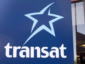An Air Transat sign is seen Tuesday, May 31, 2016 in Montreal. THE CANADIAN PRESS/Paul Chiasson