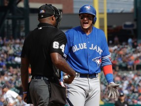 Toronto Blue Jays' Troy Tulowitzki argues his called third strike with umpire Alan Porter during the 10th inning of an MLB game against the Detroit Tigers on July 16, 2017. (AP Photo/Carlos Osorio)