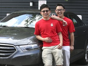 Alex Wong, (left) and is brother Mark are driving across Canada for Ronald McDonald House Charities. They swung through Toronto on Wednesday, Aug. 30, 2017. (VERONICA HENRI/TORONTO SUN)