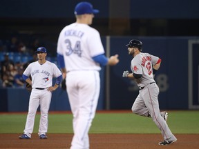 Mitch Moreland of the Boston Red Sox circles the bases after hitting a two-run home run in the seventh inning off Blue Jays reliever Tom Koehler at the Rogers Centre on Wednesday. (Tom Szczerbowski/Getty Images)