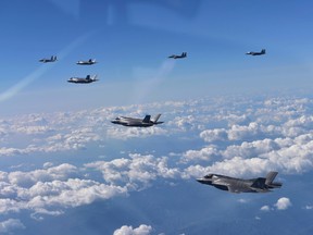 In this photo provided by South Korea Defense Ministry, U.S. Air Force F-35 stealth fighter jets and South Korean F-15 fighter jets fly over the Korean Peninsula, South Korea, Thursday, Aug. 31, 2017. (South Korea Defense Ministry via AP)