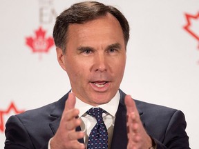 Finance Minister Bill Morneau addresses The Canadian Club of Toronto and The Empire Club regarding Budget 2017 in Toronto on March 24, 2017. THE CANADIAN PRESS/Frank Gunn