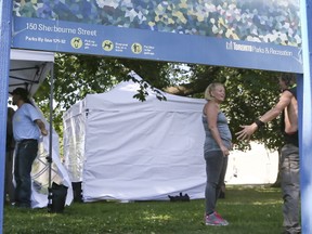 Volunteers operate a pop-up supervised injection site in Moss Park on Monday, Aug. 14, 2017, in Toronto. (VERONICA HENRI/TORONTO SUN)