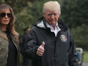 U.S. President Donald Trump gives a thumbs up as he walks with First Lady Melania Trump prior to their Marine One departure from the White House Aug. 29, 2017 in Washington, DC. (Alex Wong/Getty Images)