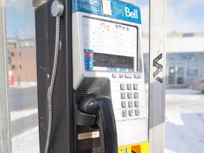 A pay phone beside the Bell Mobility store on York St. in London, Ont., is pictured in this Jan. 6, 2015 file photo. (DEREK RUTTAN/Postmedia Network)