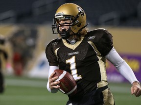 Manitoba Bisons QB Theo Deezar celebrates his rushing touchdown against the Regina Rams during CIS football action at Investors Group Field in Winnipeg on Fri., Oct. 2, 2015. The fourth-year quarterback leads the 10th-ranked Bisons into the 2017 season with 11 of 12 offensive starters returning. Kevin King/Winnipeg Sun/Postmedia Network