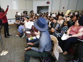 Desmond Cole leads protestors at the Toronto Police Services board meeting on Thursday, Aug. 24, 2017. (JACK BOLAND/TORONTO SUN)
