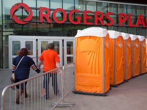 Portable toilets outside Rogers place prior to the Edmonton Oilers and San Jose Sharks NHL playoff, in Edmonton Thursday April 20, 2017. Photo by David Bloom