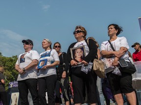 Families who have lost loved ones gather in front of the Legislature with photos of their loved ones. Edmonton’s International Overdose Awareness Day event on the steps of the Alberta Legislature.Shaughn Butts / Postmedia