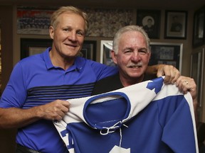 Dennis Owchar, left, and Kevin Devin in the home of the Ultimate Leafs Fan Mike Wilson on Aug. 31, 2017. (Veronica Henri/Toronto Sun/Postmedia Network)
