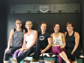 In the middle, owner of Degree CrossFit Seaforth, Kaleda Connell and several members of the gym sit with some of the donations that will be sent off to the Texas Diaper Bank for flood victims. (Shaun Gregory/Huron Expositor)