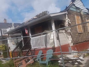 Neighbours to this Davis Street house, which suffered a fire in June and is to be demolished, say the building emits a stench. Neighbours also say they feel unsafe, as they say squatters are breaking into the abandoned structure. Jeremiah Rodriguez/The Observer