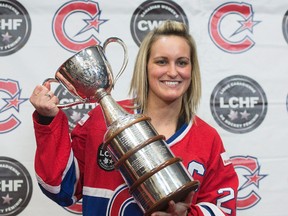 Marie-Philip Poulin, captain of Les Canadiennes de Montreal, the Canadian Women’s Hockey League champions, poses for photos with the Clarkson Cup after a news conference, Wednesday, March 8, 2017 in Brossard, Que. (THE CANADIAN PRESS/Ryan Remiorz)