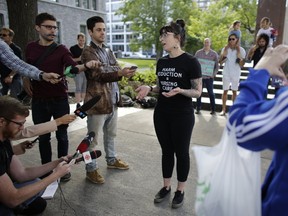 University of Ottawa Professor Marilou Gagnon, PhD, speaks to media in front of the Human Rights Monument about the importance of harm reduction services in Ottawa on Aug. 24, 2017. (David Kawai/Ottawa Citizen)
