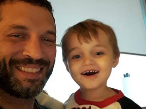 FACEBOOK PHOTO
(Left) David Akey, father to Eric Akey (right) poses with his two-year-old son who was recently diagnosed with leukemia.