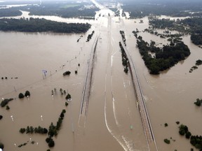 In this Aug. 29, 2017 file photo, Interstate 69 is covered by floodwaters from Harvey, in Humble, Texas. (AP Photo/David J. Phillip, File)