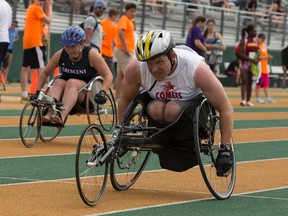 Navarra Houldin (left) with Calgary's Crescent Heights races Hunter Graves from Raymond High during their respective 100 metre wheelchair events at the 2017 ASAA High School Track and Field Provincials at Foote Field at the University of Alberta in Edmonton on Saturday, June 3, 2017.