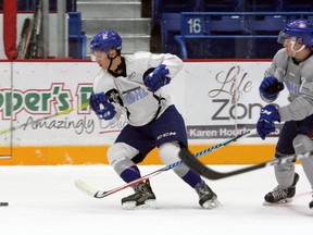 Dawson Baker, left, tries to keep the puck away from Noah Serre during a scrimmage at Sudbury Wolves training camp at Sudbury Community Arena on Friday, Sept. 1, 2017. Ben Leeson/The Sudbury Star/Postmedia Network