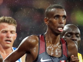 St. Catharines Collegiate graduate Mohammed Ahmed running for Canada in the men's 5,000 metres at the International Association of Athletics Federations World Championships in London. (DAVID J. PHILLIP/The Associated Press Handout/Welland Tribune/Postmedia Network)