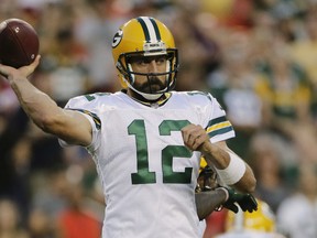 In this Aug. 19, 2017 file photo, Green Bay Packers quarterback Aaron Rodgers passes the ball during the first half of an NFL pre-season football game against the Washington Redskins in Landover, Md. (AP Photo/Mark Tenally, File)