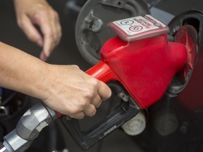 Drivers fill up at the pumps in London, Ont., where gas prices hit $1.22/litre on Friday, thanks to the impact of Hurricane Harvey. Photograph taken on Friday September 1, 2017. 
Mike Hensen/The London Free Press/Postmedia Network