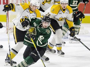 DEREK RUTTAN/Postmedia Network
London Knights' Jacob Golden falls with help from Sarnia Sting defenceman Kelton Hatcher's stick during the first period of an OHL pre-season game Friday at Budweiser Gardens  in London. Also pictured are Colton Kammerer (26) and Aidan Hughes (30) of the Sting and Robert Thomas (27) of the Knights.