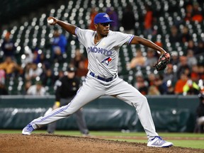 Toronto Blue Jays relief pitcher Carlos Ramirez throws to the Baltimore Orioles during the 10th inning of a baseball game in Baltimore, Friday, Sept. 1, 2017. It was his major league debut. (AP Photo/Patrick Semansky)