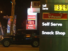 Drivers fill up their tanks at an Esso station on Lawrence Avenue East near Railside Road early Saturday morning. Gas prices across the GTA shot up to an average of $1.329/L at midnight Friday night. (John Hanley/Special to the Sun)