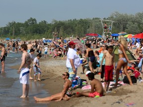 A crowd at the beach in Grand Bend earlier this year is shwon in this file photo. Lambton Public Health's weekly water quality testing program at Lake Huron Beaches has ended for the season. No beaches were posted this summer.
File photo/Postmedia Network