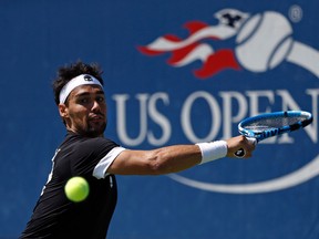 Fabio Fognini returns a shot from Stefano Travaglia during the first round of the U.S. Open Wednesday, Aug. 30, 2017, in New York. (AP Photo/Michael Noble)
