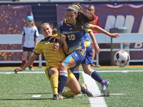 Laurentian Voyageurs' Catherine Rocca and Queen's Gaels' Matija Skoko battle it out during the first half of Ontario University Athletics women's soccer action at Richardson Stadium in Kingston, Ont., on Saturday September 2, 2017. Queen's defeated Laurentian 3-1. Steph Crosier/Kingston Whig-Standard/Postmedia Network