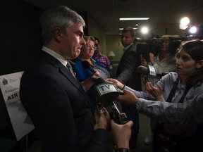 Air Transat vice-president of corporate affairs Christophe Hennebelle speaks with the media outside Canadian Transportation agency hearings, Thursday, August 31, 2017 in Ottawa. (Adrian Wyld/THE CANADIAN PRESS)