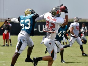 Tampa Bay Buccaneers tight end Antony Auclair (82) comes down with a pass while being defended by Jacksonville Jaguars linebacker Blair Brown during a joint practice Monday, Aug. 14, 2017, in Jacksonville, Fla. (Will Dickey/Florida Times-Union)