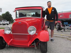 Kip McMillan stands next to the Ford Model A hot rod built by his late father, Bob McMillan. The Sarnia Street Machines hot rod and classic car club held the Bob McMillan Cruise and Poker Run Sunday to raise money for Pathways Health Centre for Children.
Paul Morden/Sarnia Observer/Postmedia Network