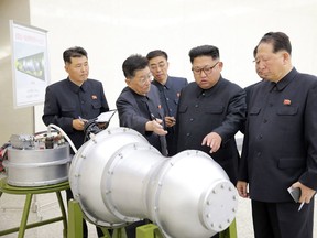 This undated photo released by the Korean Central News Agency (KCNA) on September 3, 2017 shows North Korean leader Kim Jong-Un looking at a metal casing at an undisclosed location. North Korea claims it has developed a hydrogen bomb which can be loaded into the country's new intercontinental ballistic missile. (Korean Central News Agency/Korea News Service via AP)