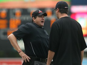 Home plate umpire Kurt Branin (left) has a discussion with Fargo-Moorhead RedHawks manager Michael Schlact during American Association baseball action against the Winnipeg Goldeyes at Shaw Park in Winnipeg on Sun., Sept. 3, 2017. The RedHawks announced Sunday that long-time manager and former Goldeyes skipper had been fired after 22 seasons with the team and replaced as interim manager by Schlact, the team's pitching coach. Kevin King/Winnipeg Sun/Postmedia Network