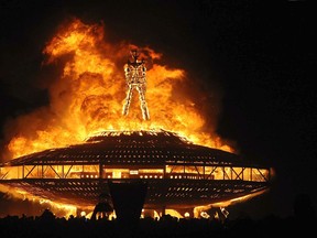 In this Aug. 31, 2013, file photo, the "Man" burns on the Black Rock Desert at Burning Man near Gerlach, Nev. (Andy Barron/Reno Gazette-Journal, File via AP)