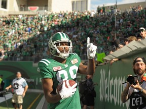 Saskatchewan Roughriders wide receiver Duron Carter celebrates a touchdown by taunting Winnipeg Blue Bombers fans during first half CFL action in Regina on Sunday, September 3, 2017. THE CANADIAN PRESS/Mark Taylor