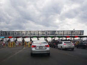 Cars line up to cross into the US at the US/Canada border on February 25, 2017. (Don Emmert/Getty Images)